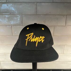 PRINCE
Logo Flatbrim Snapback Baseball Cap in Black and Gold